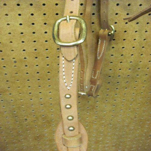 A brown leather Big Horn Futurity Knot Brass Headstall with a brass buckle.