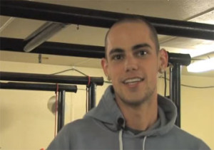 Nicholas Hurd, a man in a gray hoodie, standing in a gym.