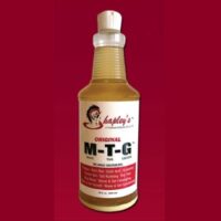 A bottle of Shapley's M-T-G 32 oz on a red background.