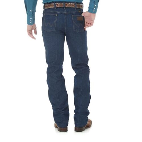 A man wearing a blue shirt and jeans, specifically Men's Wrangler Performance Slim Fit Cowboy Cut 36MWZPD.