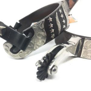 A pair of Men's Black Satin Spur 257740 belts with stars on them.