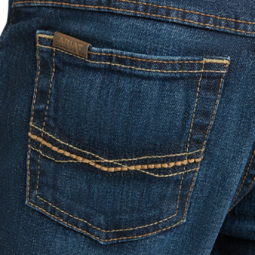 A close up view of a man's Boy's Ariat Jeans B4 Relaxed Boot Cut 10027675 pocket.