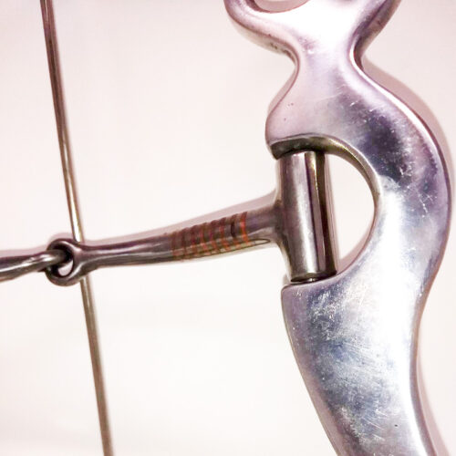 A close up of an Aluminum 8 1/4" Shank Snaffle Bit archery bow.