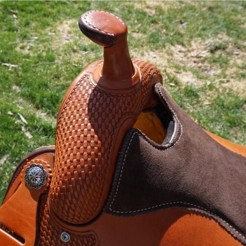 A close up of a 16" Custom Square Skirt Reining Saddle with brown leather and brown stitching. (Product Name: 16" Custom Square Skirt Reining Saddle)