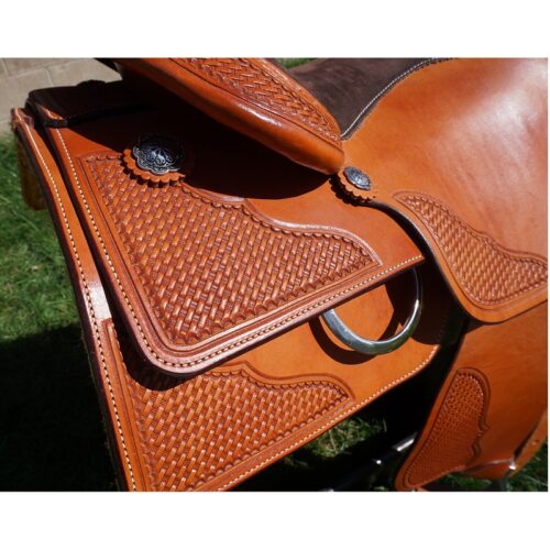 A close up of a 16" Custom Square Skirt Reining Saddle with a tan leather seat.