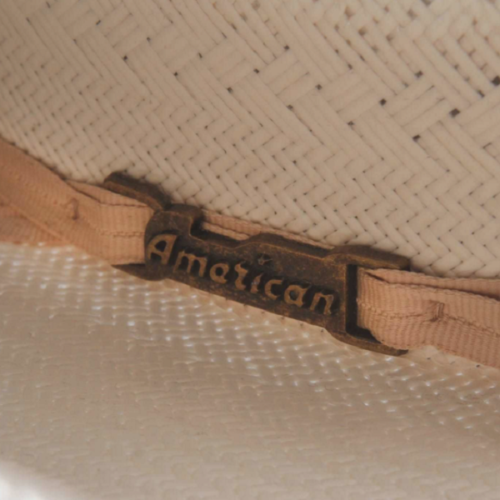 A close up of an American Straw Hat 6800 Rancher with a label on it.