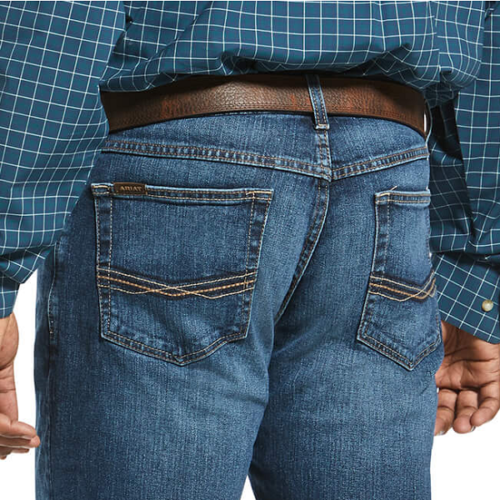 The back of a man wearing the Ariat Men's M4 Legacy Stretch Jean 10022674 and a plaid shirt.