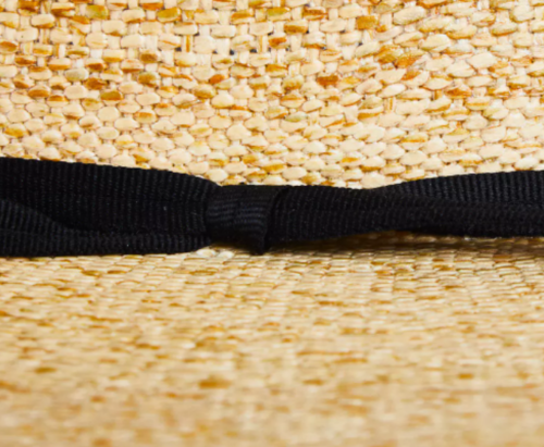 A close up of the Rodeo King Bangora Straw Hat with a black ribbon.