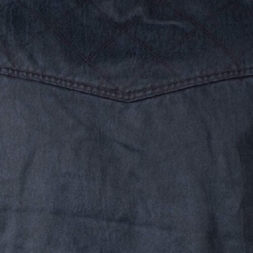 A close up of a dark blue denim jacket featuring the Women's Outback Carry Concealed Heidi Vest.