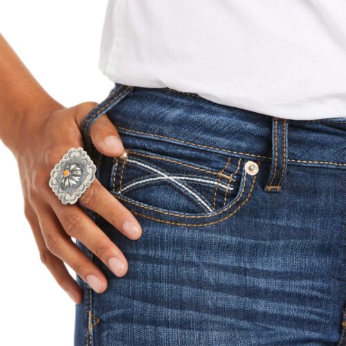 A woman wearing **Women's Ariat Rosa Jean** with a ring in her pocket.