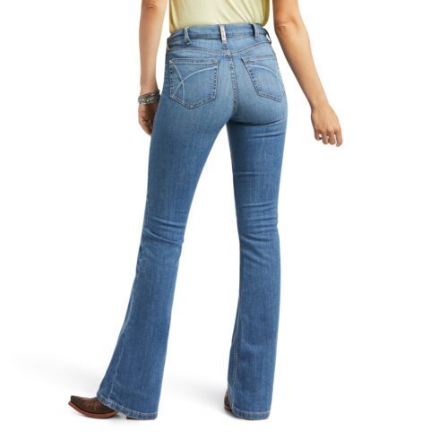 The back view of a woman wearing Ariat Women's Tennessee Jean flared jeans.