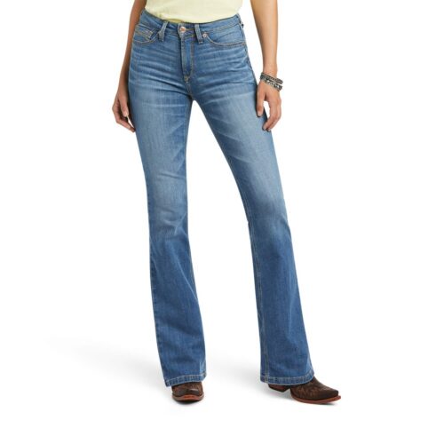 A woman stylishly dressed in a pair of Ariat Women's Tennessee Jean and a plain t-shirt.