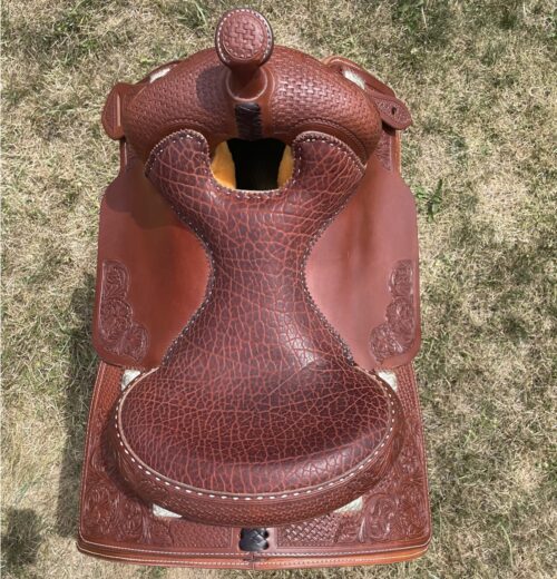 Bob's Lady Reiner 16" Saddle: A saddle with a brown leather seat.