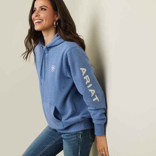 Woman wearing a blue Ariat hoodie.