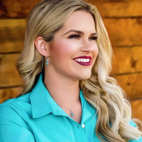 Woman with blonde hair wearing turquoise jewelry.