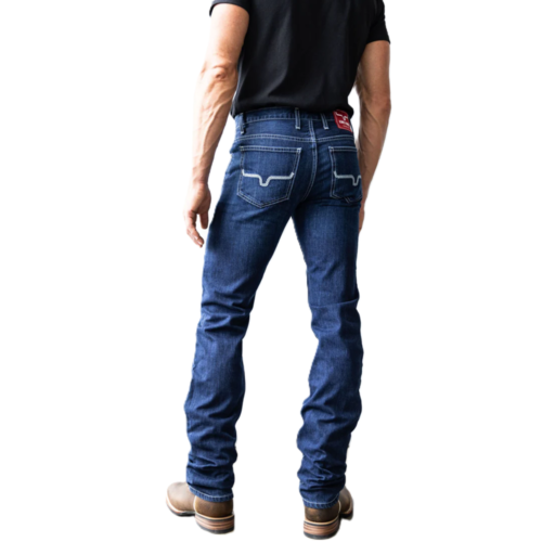 Man wearing blue jeans from behind.