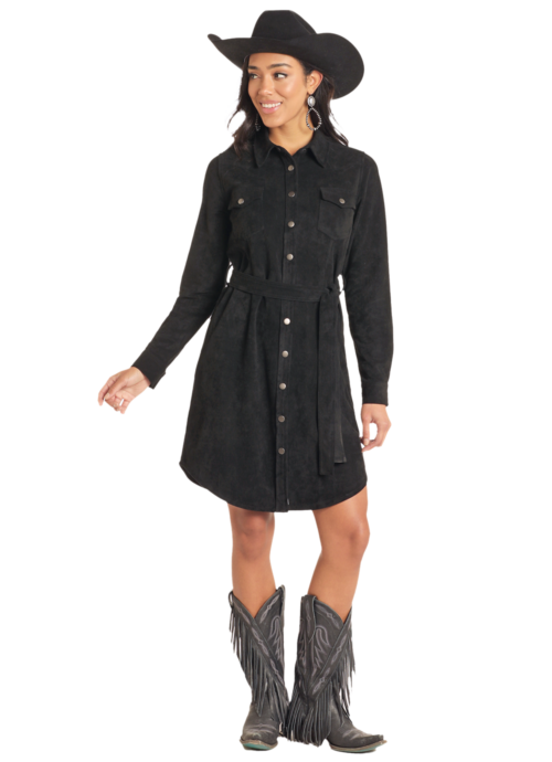 Woman in black suede shirt dress and boots.